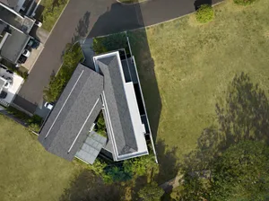 A modern house with a concrete and metal exterior.