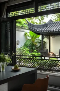 Modern living room with metal frame, glass handle, and chartreuse green banana