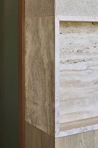 Modern bathroom featuring marble and concrete materials.