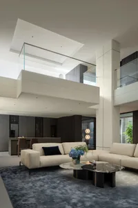 Modern living room with neutral-colored leather furniture and minimalist decor.