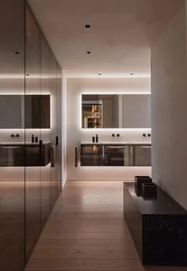 Modern minimalist bathroom with a glass floor and sleek design features.