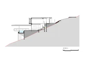 A modern residential house section plan showing the architectural design on a hillside.
