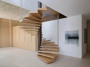 A modern floating staircase made of wood.