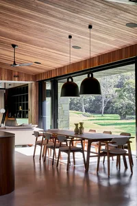 Modern residential kitchen featuring wooden ceiling and pendant lighting.