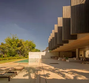 Modern residential exterior with concrete materials and design.