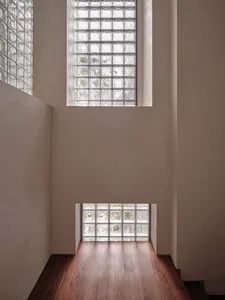 A rendering of an interior space featuring glass block walls.