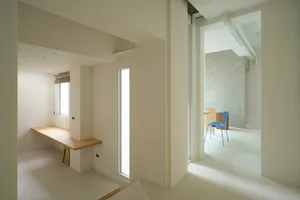 Modern minimalist white interior space with simple design elements.