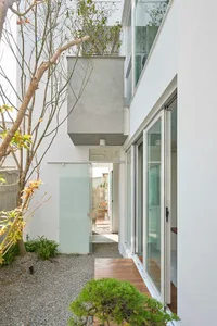 A modern residential exterior featuring concrete minimalist design.