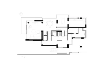 A detailed black and white architectural drawing of a residential floor plan with modern design elements.