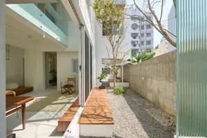 Modern residential space featuring wood and concrete materials.