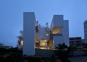 A modern residential building constructed primarily of concrete.