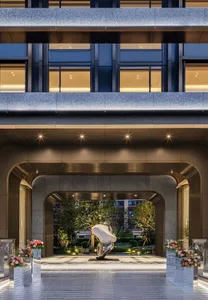 Modern hotel lobby with concrete and glass architectural elements
