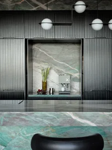 Modern kitchen with a marble counter and minimalist design.