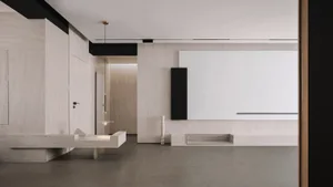 A modern entryway with concrete walls and floor.