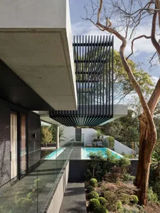 Outdoor contemporary residential area showcasing modern minimalist architecture with concrete and glass materials.