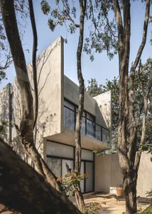 Modern residential house featuring a contemporary exterior made of concrete.