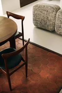 Modern residential interior with wood furniture and fabric seating.