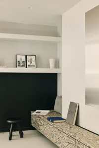 Minimalist interior space featuring wood accents