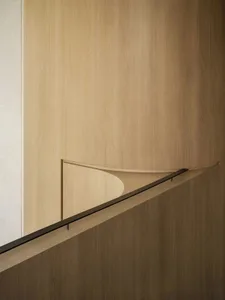 Modern interior design featuring wood-paneled walls and sleek, minimalist decor.