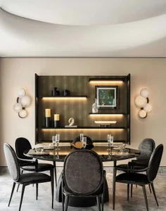 A modern minimalist dining room featuring metallic shelving with ambient lighting and stylish furniture.