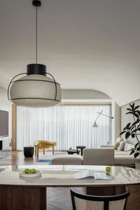 A minimalist living room featuring neutral tones and modern furniture.