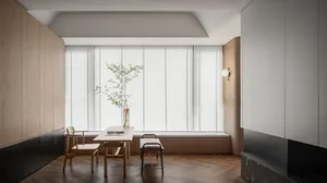 Modern minimalist living room featuring wooden furniture and white blinds.