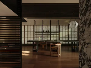 Modern dining room featuring marble, black metal table, and wooden chairs