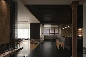 Modern interior design featuring marble floors, wooden furniture, and metal accents.