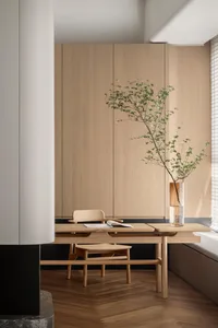 A modern minimalist office space featuring wooden furnishings.