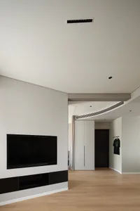 Modern living room featuring wooden furniture and minimalist decor