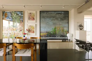 A modern minimalist interior featuring artwork in a residential setting.