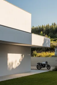 A minimalist exterior of a modern building with a concrete finish.