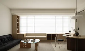 Modern living room with a wooden sofa, coffee table, and built-in shelves.