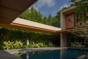 A modern house featuring stone and wood materials.