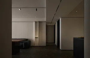 Modern interior design with white walls and black furniture, showcasing contemporary style.
