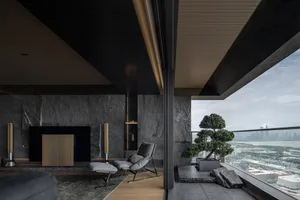Modern minimalist living room featuring stone and concrete accents