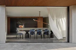 Modern dining room featuring concrete flooring and minimalist design.