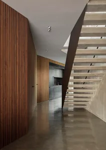 Modern kitchen interior with concrete walls and minimalist design.