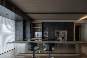 Modern kitchen with metal, wood, and stone materials