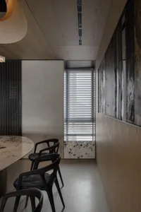 A modern office space features sleek metal and glass materials.