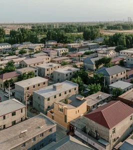 Aerial view of residential buildings with concrete and brick exteriors, featuring distinctive terrazzo flooring.