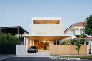 Modern residential house featuring wooden and glass exterior panels