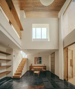Modern interior design featuring wooden elements and a minimalist aesthetic.