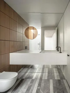 A modern bathroom featuring a floating counter and wooden surfaces.