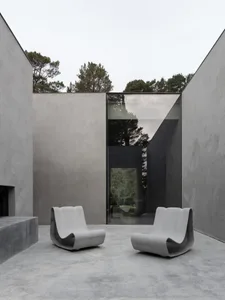 Modern architecture with minimalistic lines and concrete materials.