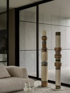 Modern, minimalist living room with industrial concrete surfaces and contemporary furniture.