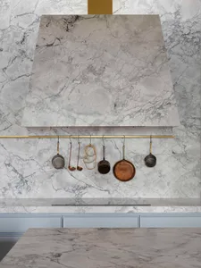 Modern kitchen featuring marble countertops and backsplash.