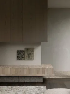 A minimalist interior design featuring a tiled counter surface.