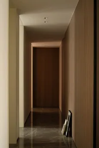 A minimalist modern interior featuring clean lines, sleek surfaces, and a monochromatic color palette.