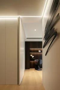 Minimalist modern office space with sleek, contemporary furniture and lighting.
